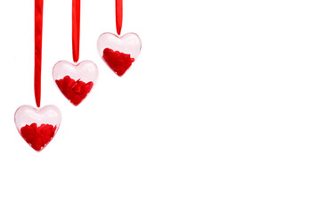 Transparent hearts with red confetti inside on a white isolated background. Valentine's day greeting card concept. Banner, copy space