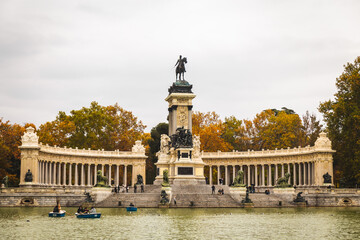 Fototapeta na wymiar Parque de El Retiro Spain Madrid capital pond cloudy day Monument to Alfonso XII