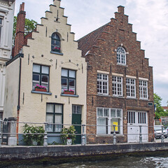 Picturesque old classical buildings on the canal in Brugge, Belgium