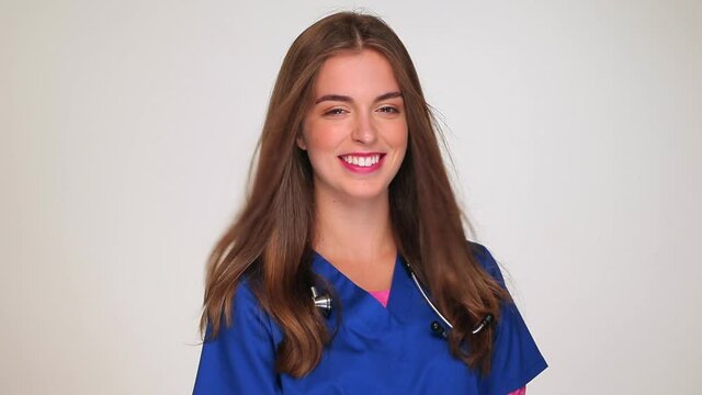 Smiling nurse in scrubs