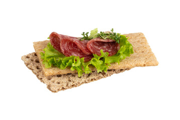 Variety of mini sandwiches with cream cheese, vegetables and salami.