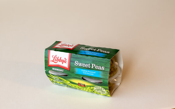 BEMIDJI, MN - 17 NOV 2020: Package of Libbys Sweet Peas in four plastic containers. The label says it is microwavable and lightly seasoned with sea salt and USA Grown.