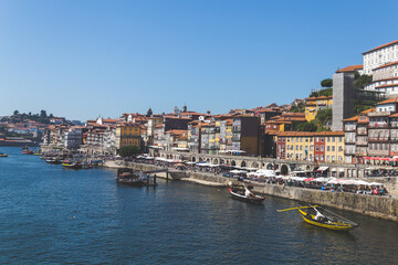 Fototapeta premium Porto Portugal Douru river coast day sunlight sunshine blue sky boats