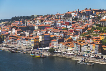 Fototapeta na wymiar Porto Portugal Douru river coast day sunlight sunshine blue sky boats