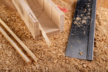 Cutting small pieces of wood with a saw in a carpentry shop. Minor carpentry work in a home...