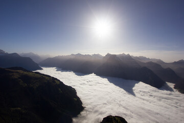 Fog sea on a sunny day in the swiss mountains