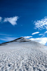 snowy peak in Svalbard with footprints in the snow