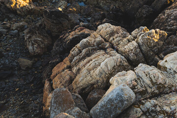 Praia do Coral sunset Viana do Castelo Portugal shore coast beach rocks waves water rocks close up 