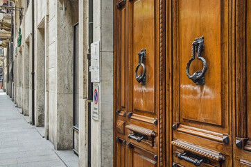 Luxurious wooden door with doorknob in Savona, Italy