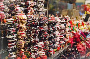 Strawberry in chocolate in the maarket of Barcelona, Spain