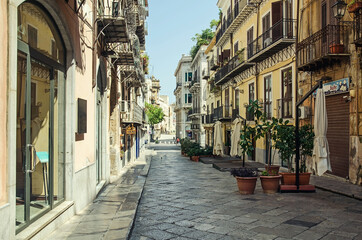 Fototapeta na wymiar Empty street in the old town in Palermo, Italy