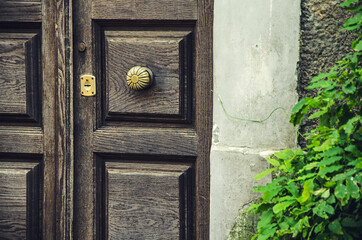 Old wooden door on the street of Naples, Italy