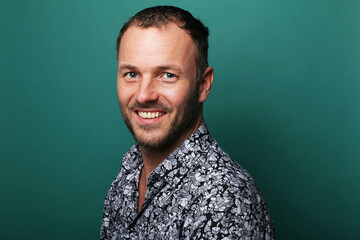 Portrait of a man in front of a colored background