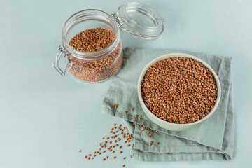 Buckwheat groats close up. Grains of raw buckwheat as a abstract background texture.
