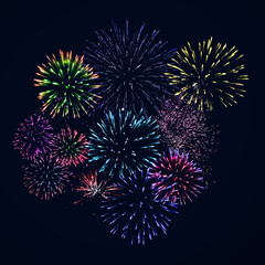 Colorful fireworks of various colors over night sky. Celebration and anniversary concept.