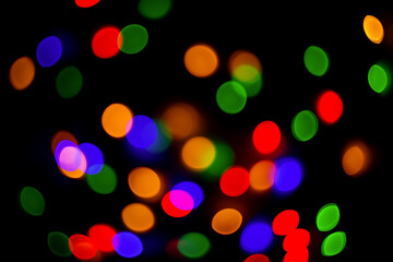 New year's bokeh background. Christmas colored lights. Defocused. Abstract background.