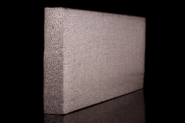 Block of graphite polystyrene isolated on the black background