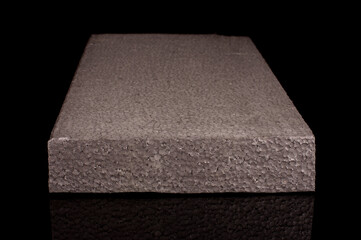Block of graphite polystyrene isolated on the black background