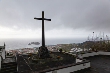 Our Lady of Peace Chapel Ermida de Nossa Senhora da Paz Sao Miguel island Portugal cloudy weather day cross 