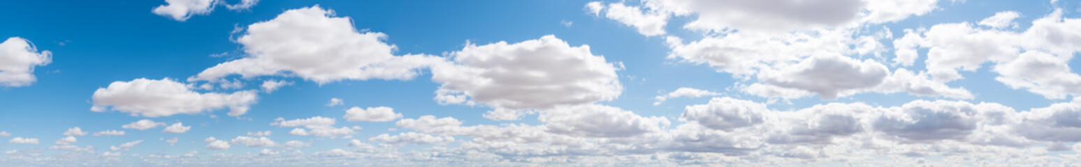 Fototapeta na wymiar Blue Sky with Puffy White Clouds Panorama Background-2