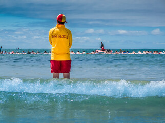 Surf lifesaver watching for danger at a beach in Australia