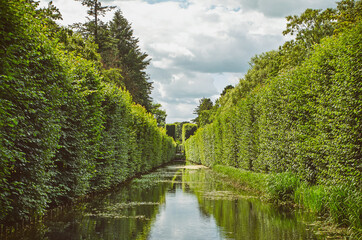River with green walls in the park of Gdansk, Poland