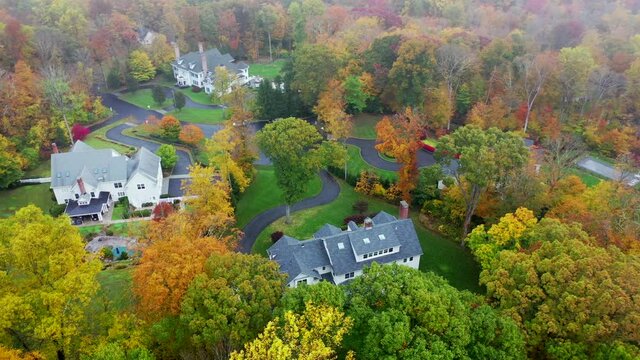 Aerial Orbit of Luxury Homes on a Rainy, Misty Day