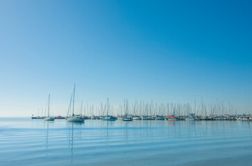 Obraz premium Yachts moored in a tranquil harbour
