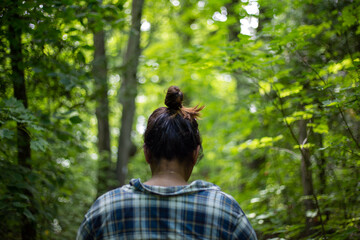Person walking through forest