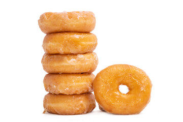 donuts with icing sugar stacked on white background