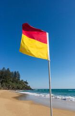 Red and yellow flag, indicating a safe and patrolled beach in Australia