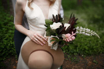 wedding bouquet in the hands of the bride