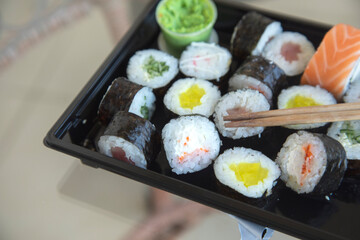 sushi with sticks on the table