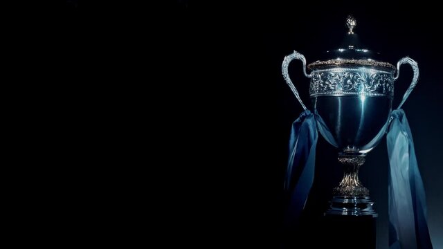 Silver trophy cup standing isolated. Premium award of sport achievement in football or soccer. Best prize for success. Brilliant result of playoff and championship. Concept of winner and champion