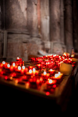 lighted candles in the temple. prayer concept. wax candles.