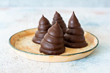 Fludebolle (Fludebolly) Denmark's national dessert. Cake made from Italian meringue (egg white cream), shortcrust pastry, covered with dark chocolate. Delicious Chocolate Dessert.