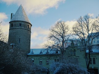 Ancient tower and houses of the old town on a clear winter day