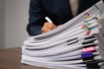 Stack overload document report papers, business paperless concept.