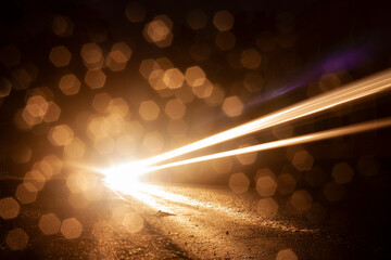 Horizontal night abstract picture with numerous of bokeh bright glow and track from the headlights...