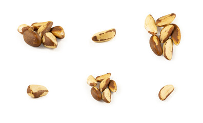 A handful of Brazil nuts on a white background