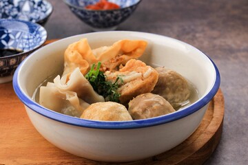Bakso Malang, Meatball Soup with Various Side Dish like Tofu Fried Shiumay, or Bakso Goreng. Served on the Table