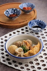 Bakso Malang, Meatball Soup with Various Side Dish like Tofu Fried Shiumay, or Bakso Goreng. Served on the Table