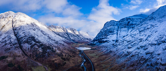 an aerial view of Glen Coe in winter near rannoch moor in the argyll region of the highlands of scotland showing snow dusting on the mountains and munros © Andy Morehouse