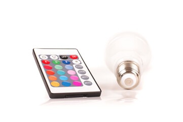 Remote control and LED bulb isolated on the white
