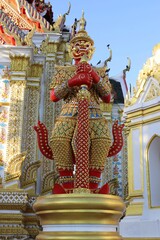Fototapeta premium Guardian giant is standing in front of church Buddhist temple closeup.