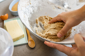Homemade bakery, making gingerbread cookies. Christmas baking preparation step by step. Kneading the dough