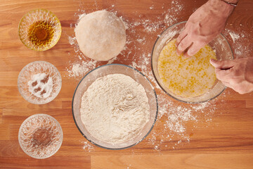 Making italian pizza step by step: mixing ingredients