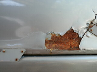 car cracked and peeling paint with rusty texture.
