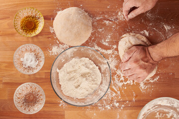 Making italian pizza step by step: kneading the dough