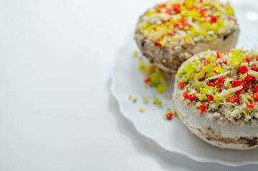 Mushrooms stuffed with onion, garlic, leek, paprika and sprinkled with cheese and breadcrumbs, snack prepared for baking